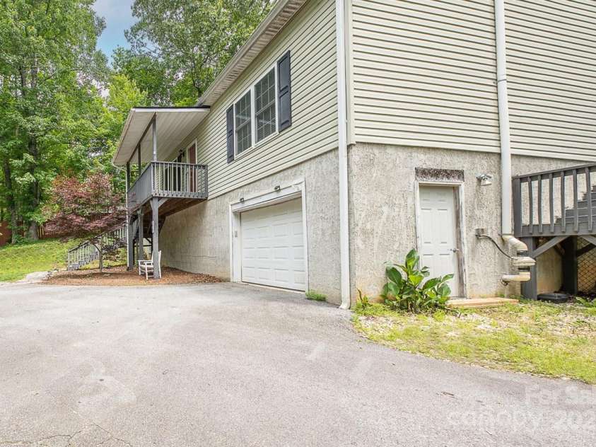 46 Badger Run, Hendersonville, NC 28739.  MLS# CAR4281037, YatesRealty ID 34340. Exterior entrance to downstairs living space for in-law, teenager or rental potential.