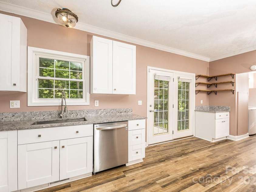 46 Badger Run, Hendersonville, NC 28739.  MLS# CAR4281037, YatesRealty ID 34340. French doors lead to outside deck and pastoral setting.