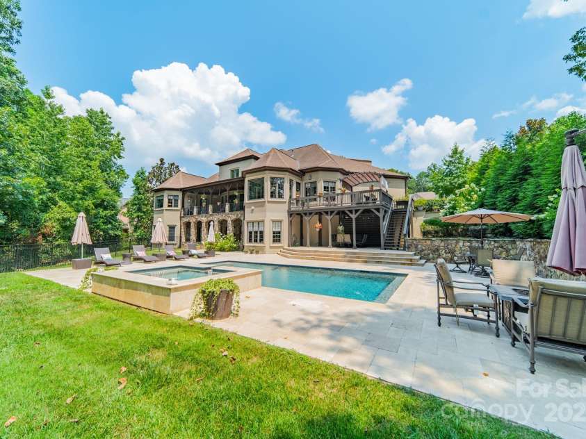 1032 Seminole Drive, Waxhaw, NC 28173.  MLS# CAR4264733, YatesRealty ID 34341. Newer Pool and very large travertine patio.