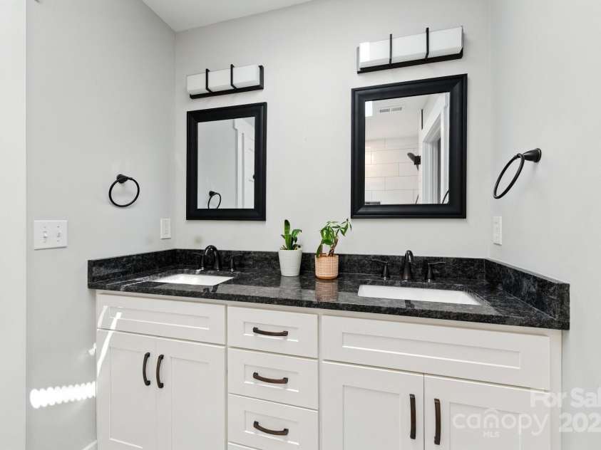 38 Tipton Drive, Candler, NC 28715.  MLS# CAR4275923, YatesRealty ID 34342. Dual Vanity in Primary Bathroom