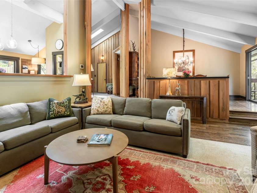 33 Deerhaven Lane, Asheville, NC 28803.  MLS# CAR4276506, YatesRealty ID 34343. A more casual dining space completes the flow from the kitchen to the main living area