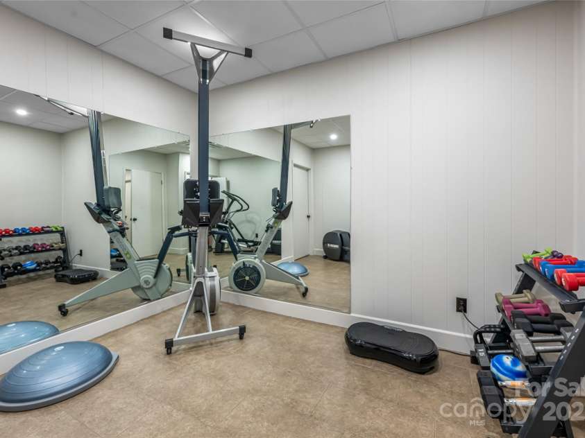 33 Deerhaven Lane, Asheville, NC 28803.  MLS# CAR4276506, YatesRealty ID 34343. Lower level flex room/office/exercise room/studio