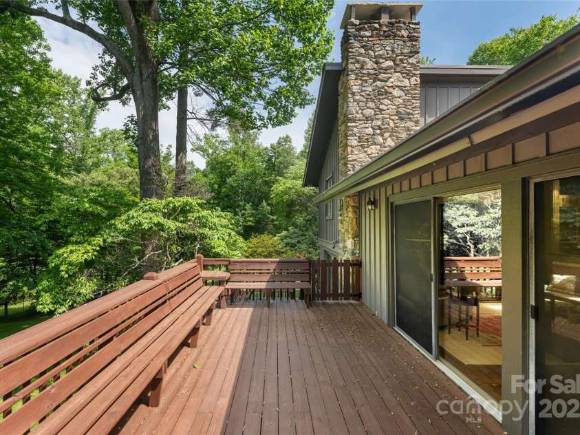 33 Deerhaven Lane, Asheville, NC 28803.  MLS# CAR4276506, YatesRealty ID 34343. Multi-level porches allow for peaceful outdoor relaxation