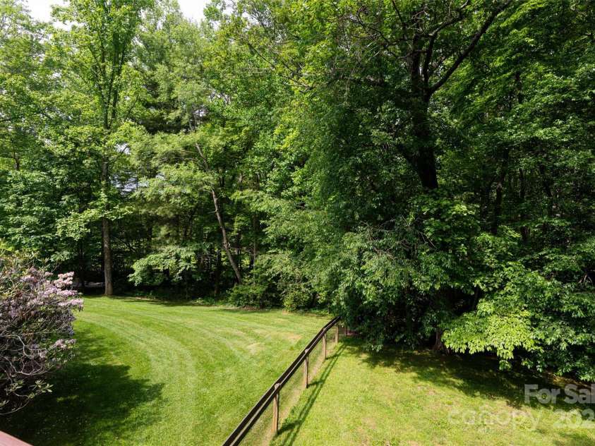 33 Deerhaven Lane, Asheville, NC 28803.  MLS# CAR4276506, YatesRealty ID 34343. Partially fenced area perfect for animals or kids to roam