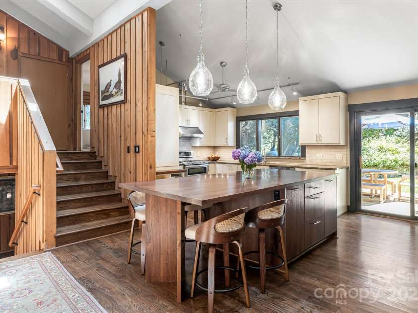 33 Deerhaven Lane, Asheville, NC 28803.  MLS# CAR4276506, YatesRealty ID 34343. The open floorplan in the homes main living areas lend easy to entertaining inside and outdoors