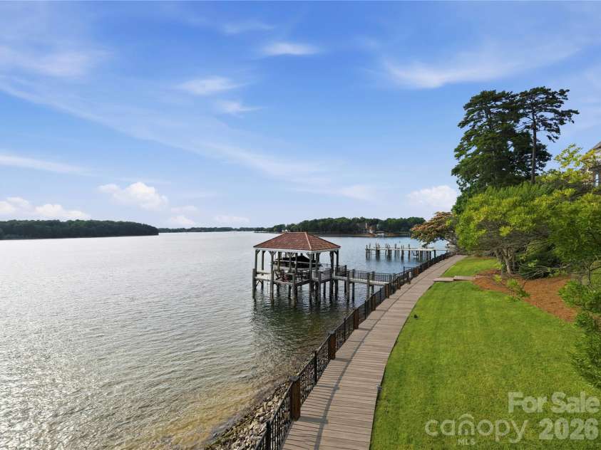 16920 Harbor Master Cove, Cornelius, NC 28031.  MLS# CAR4394741, YatesRealty ID 34351. Shoreline promenade. (AI photo - currently being installed.)