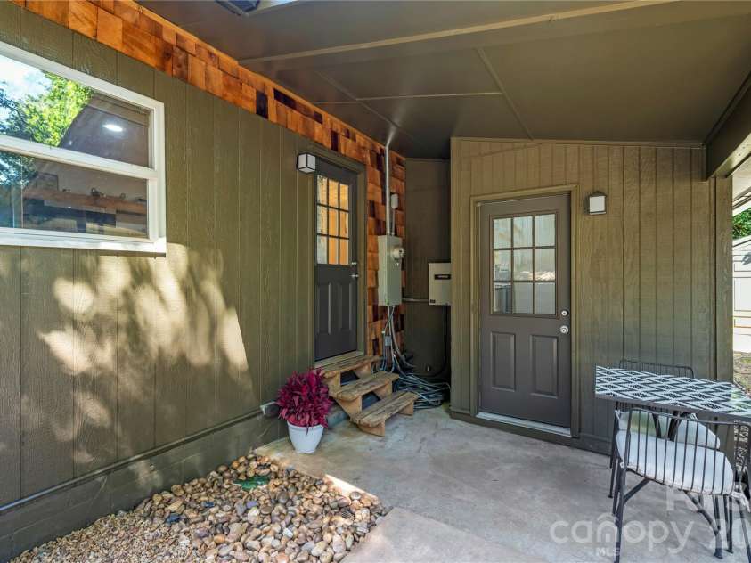 2323 Greater Druid Hills Boulevard, Hendersonville, NC 28791.  MLS# CAR4388400, YatesRealty ID 34352. Back Patio