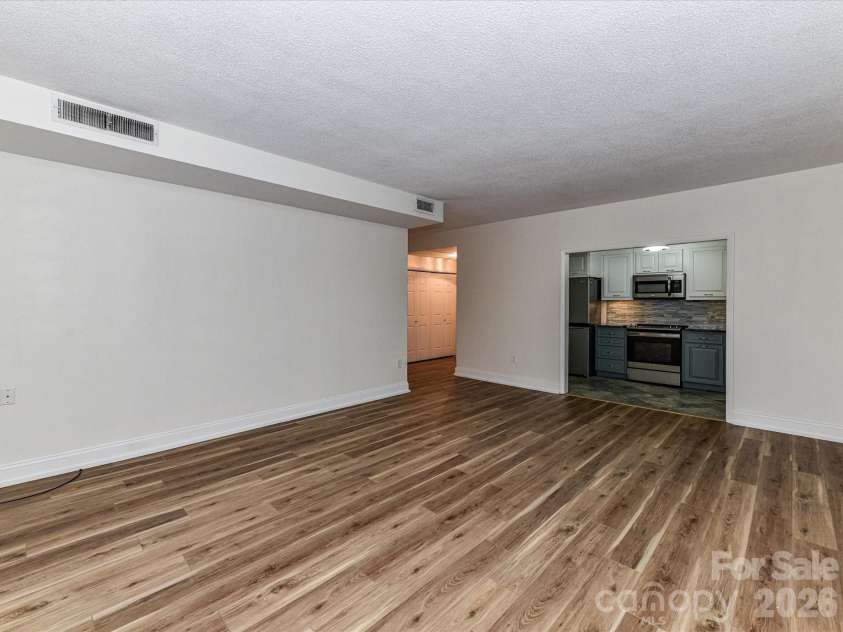 1300 Reece Road, Charlotte, NC 28209.  MLS# CAR4318620, YatesRealty ID 3436. Family Room Area with view towards the Kitchen