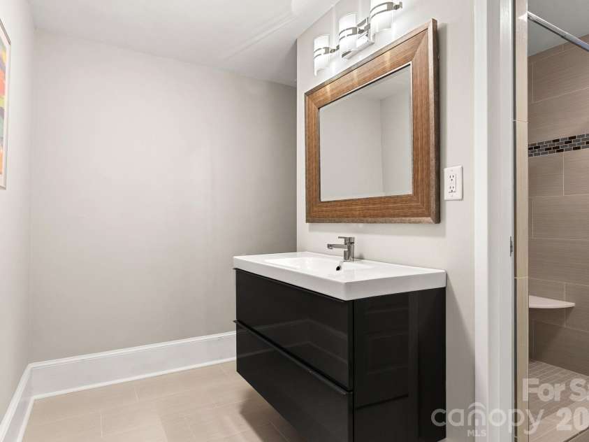1300 Reece Road, Charlotte, NC 28209.  MLS# CAR4414970, YatesRealty ID 3436. Guest bath updated in 2016