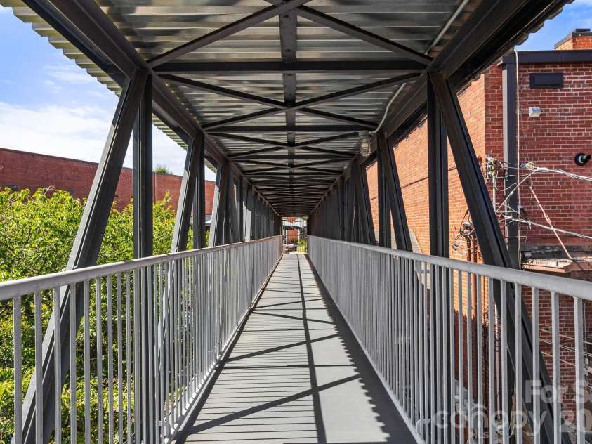 1300 Reece Road, Charlotte, NC 28209.  MLS# CAR4414970, YatesRealty ID 3436. Private Covered Pedestrian Bridge just for the Kimberlee owners