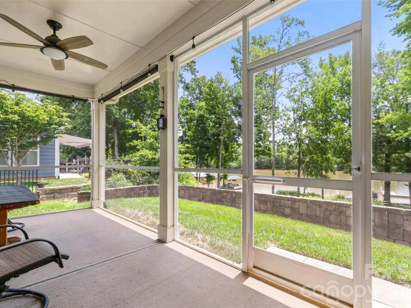 25566 Seagull Drive, Lancaster, SC 29720.  MLS# CAR4391988, YatesRealty ID 34360. Screen porch overlooking dock 