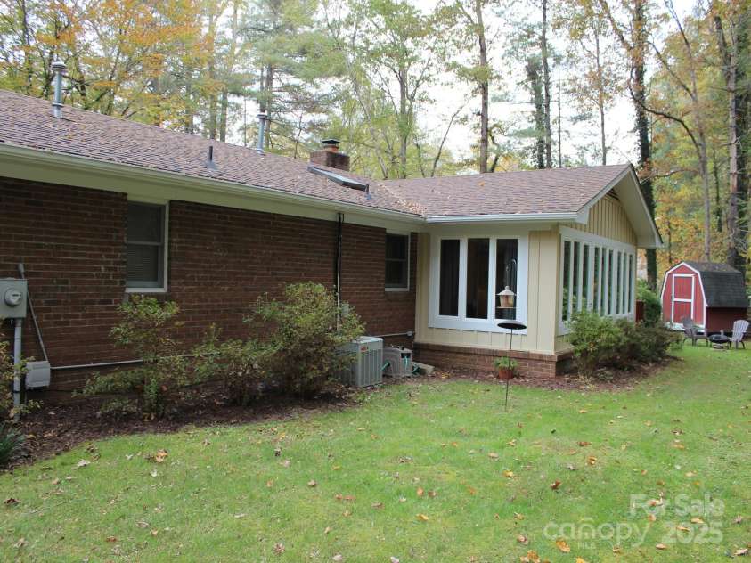 106 Laurel Lane, Etowah, NC 28729.  MLS# CAR4285948, YatesRealty ID 34361. Back with sunroom