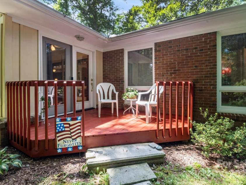 106 Laurel Lane, Etowah, NC 28729.  MLS# CAR4285948, YatesRealty ID 34361. Cozy and quiet deck perfect for lounging and reading