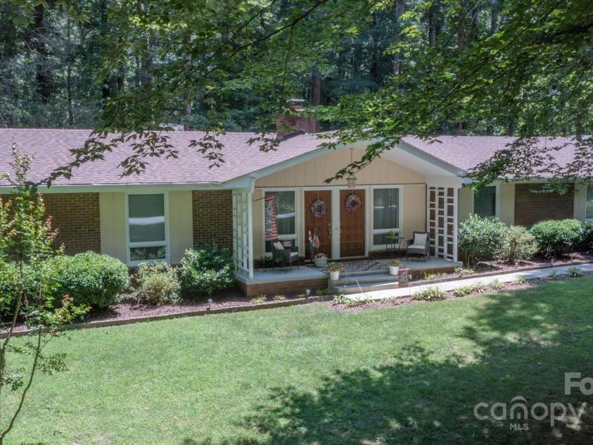 106 Laurel Lane, Etowah, NC 28729.  MLS# CAR4285948, YatesRealty ID 34361. Drone of front and porch