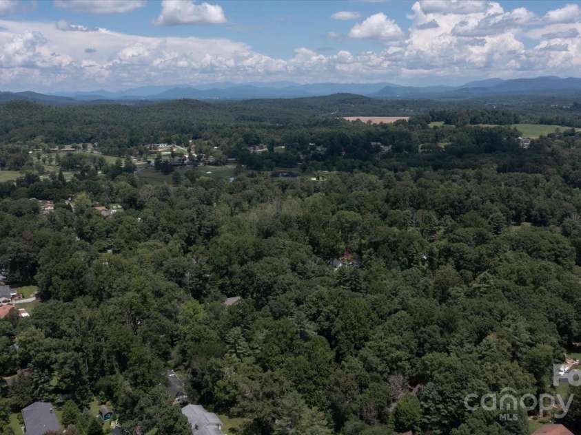 106 Laurel Lane, Etowah, NC 28729.  MLS# CAR4285948, YatesRealty ID 34361. Drone view of mountains