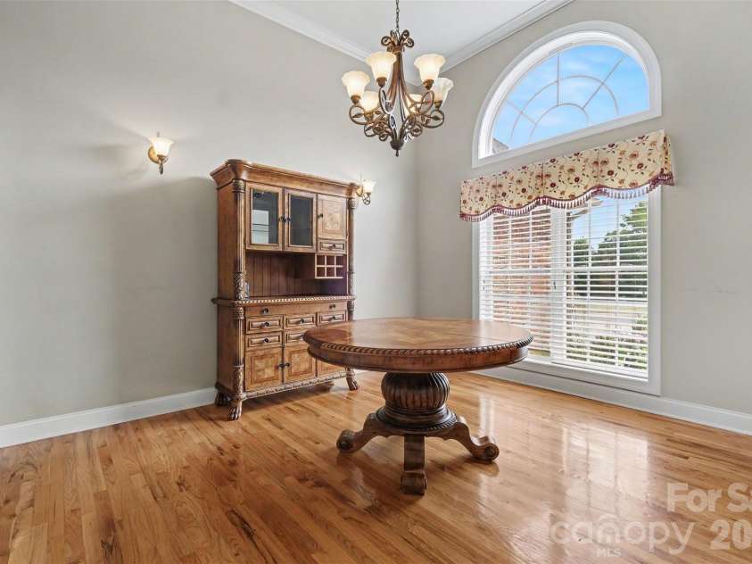115 Blakemore Drive, Shelby, NC 28152.  MLS# CAR4393685, YatesRealty ID 34369. A closer look at the dining room that has plenty of space for a large table and additional furniture pieces. The wall sconces are a nice touch!