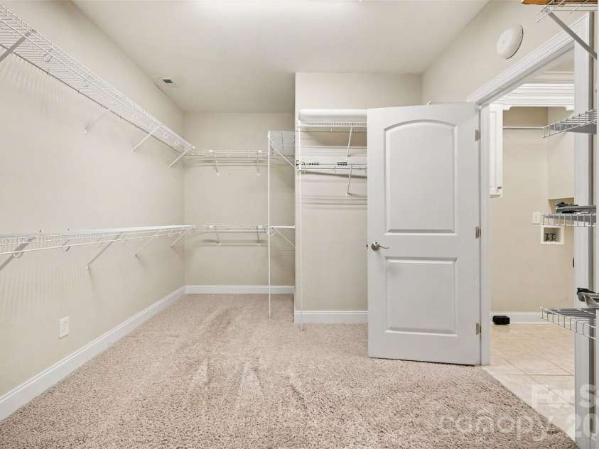 115 Blakemore Drive, Shelby, NC 28152.  MLS# CAR4393685, YatesRealty ID 34369. On the opposite side of the primary bath is this HUGE walk-in closet with access to the laundry room...SO CONVENIENT!