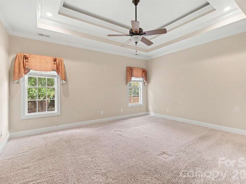 115 Blakemore Drive, Shelby, NC 28152.  MLS# CAR4393685, YatesRealty ID 34369. This home offers a true split bedroom floor plan for added privacy. The primary bedroom features include neutral paint and carpet, and a beautiful tray ceiling...