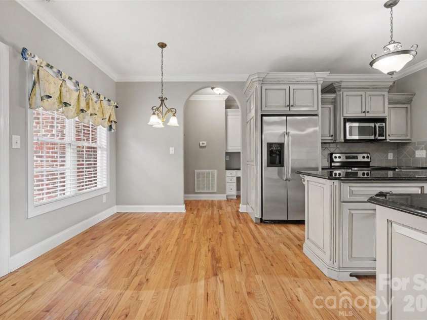 115 Blakemore Drive, Shelby, NC 28152.  MLS# CAR4393685, YatesRealty ID 34369. View from living room into breakfast area and kitchen