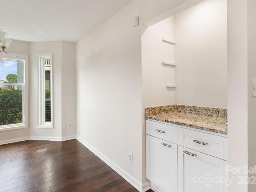 18647 Vineyard Point Lane, Cornelius, NC 28031.  MLS# CAR4294074, YatesRealty ID 34373. Dining Area with small wet bar