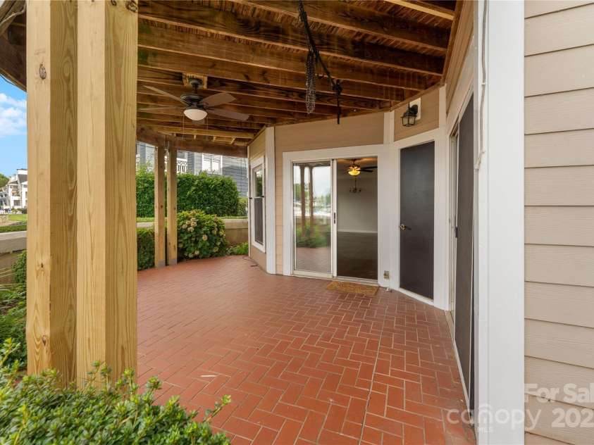 18647 Vineyard Point Lane, Cornelius, NC 28031.  MLS# CAR4294074, YatesRealty ID 34373. Oversized lower level patio - Posts have since been painted white