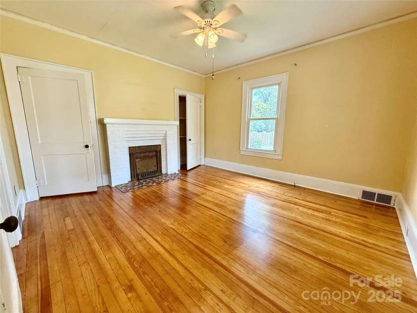 122 Beaver Street, Forest City, NC 28043.  MLS# CAR4294326, YatesRealty ID 34376. Front bedroom with original fireplace (nonfunctional)