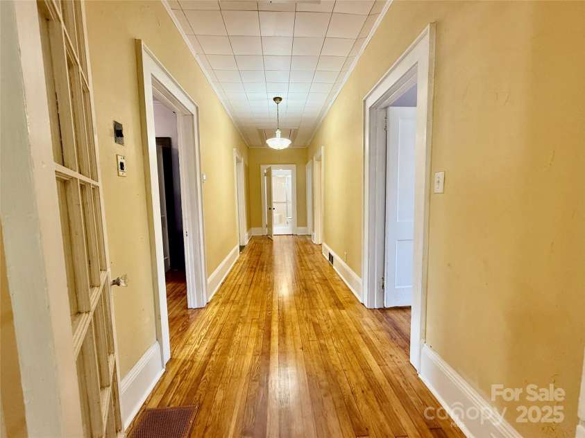 122 Beaver Street, Forest City, NC 28043.  MLS# CAR4294326, YatesRealty ID 34376. Hallway gives separation between bedrooms & living spaces