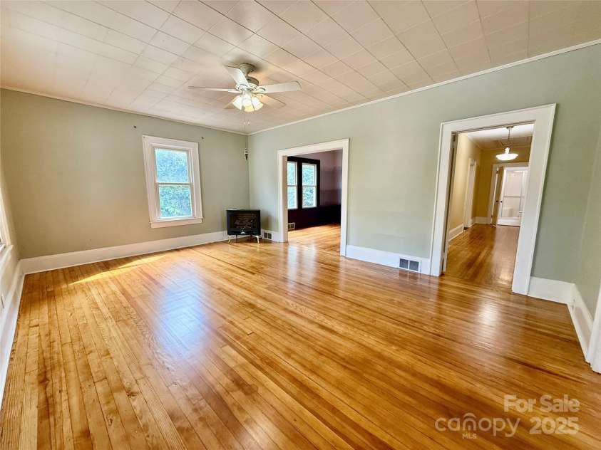 122 Beaver Street, Forest City, NC 28043.  MLS# CAR4294326, YatesRealty ID 34376. Large living room with fireplace