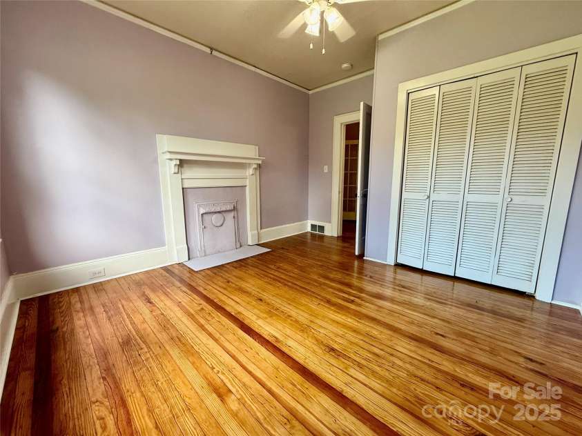 122 Beaver Street, Forest City, NC 28043.  MLS# CAR4294326, YatesRealty ID 34376. Middle bedroom with original fireplace (nonfunctional)