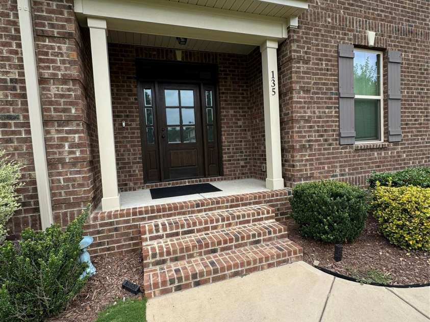 135 Coral Rutledge Drive, Mount Holly, NC 28120.  MLS# CAR4294017, YatesRealty ID 34378. Exterior 2 - Covered Front Porch