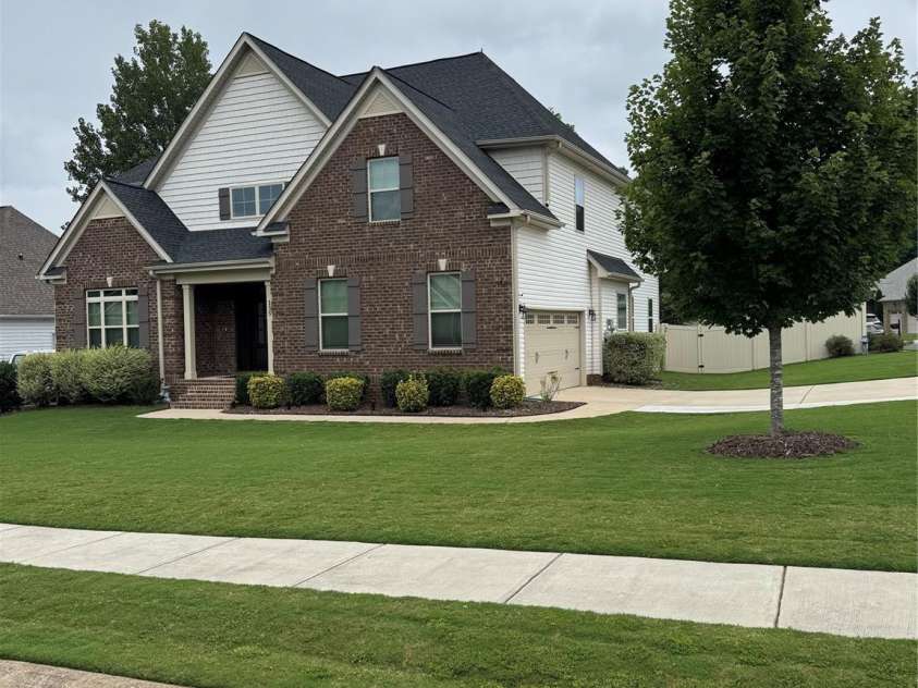 135 Coral Rutledge Drive, Mount Holly, NC 28120.  MLS# CAR4294017, YatesRealty ID 34378. Exterior - Side Load Garage