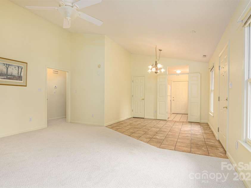 222 Rocky Mountain Way, Arden, NC 28704.  MLS# CAR4285995, YatesRealty ID 34382. Living Room Looking Toward Dining Room and Kitchen