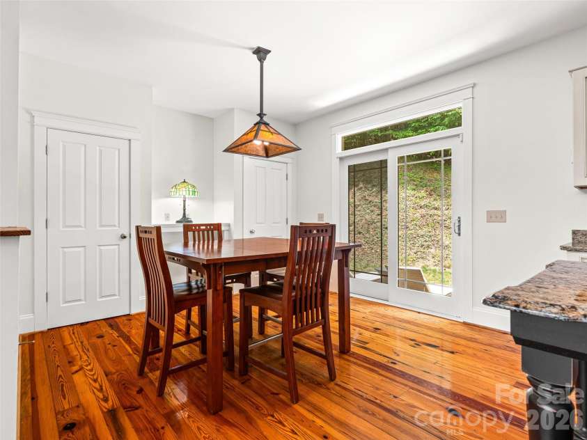 890 Stoney Stream Lane, Arden, NC 28704.  MLS# CAR4395817, YatesRealty ID 34385. Dining area with pantry and doors out to back patio.