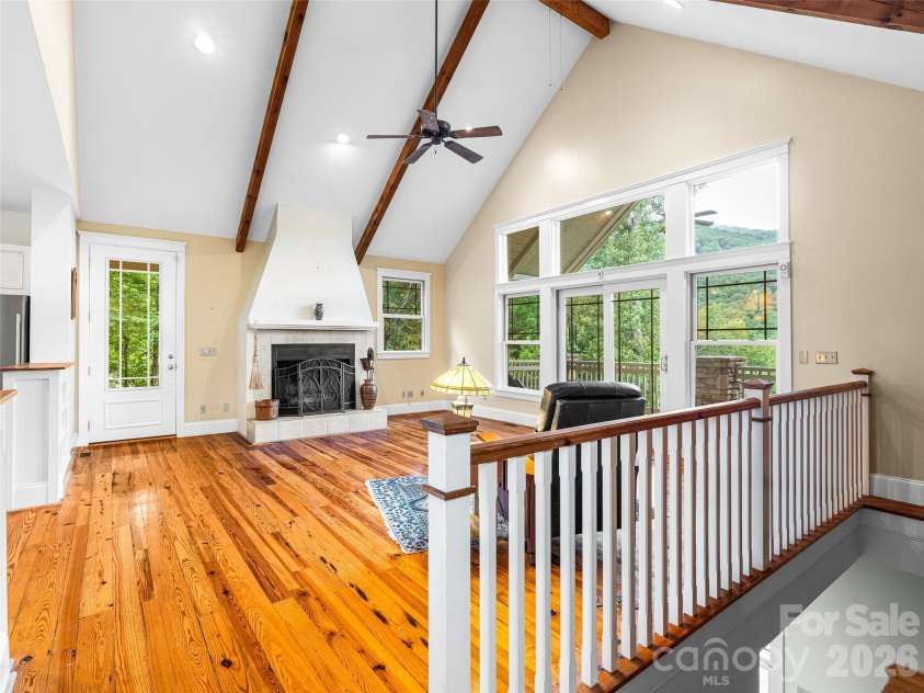 890 Stoney Stream Lane, Arden, NC 28704.  MLS# CAR4395817, YatesRealty ID 34385. Great room with stairs down to lower level.