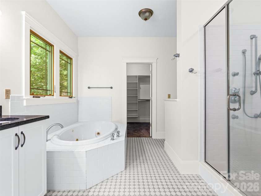 890 Stoney Stream Lane, Arden, NC 28704.  MLS# CAR4395817, YatesRealty ID 34385. Jetted tub, shower and closet in primary bathroom.