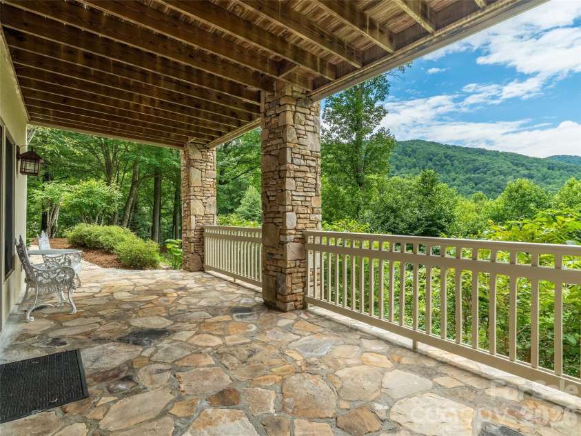 890 Stoney Stream Lane, Arden, NC 28704.  MLS# CAR4395817, YatesRealty ID 34385. Lovely flagstone covered patio accessed from lower level. 