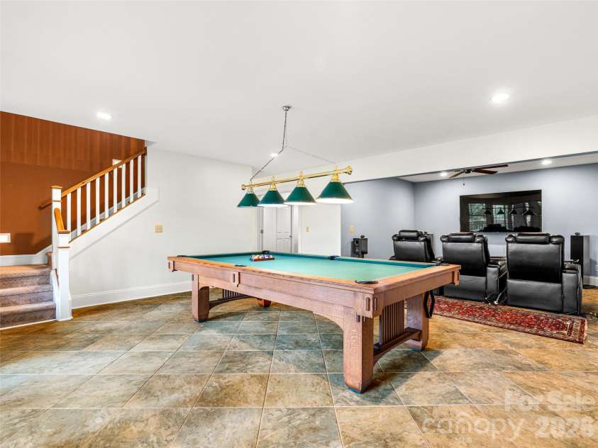 890 Stoney Stream Lane, Arden, NC 28704.  MLS# CAR4395817, YatesRealty ID 34385. Lower level flex area with pool table and media room.