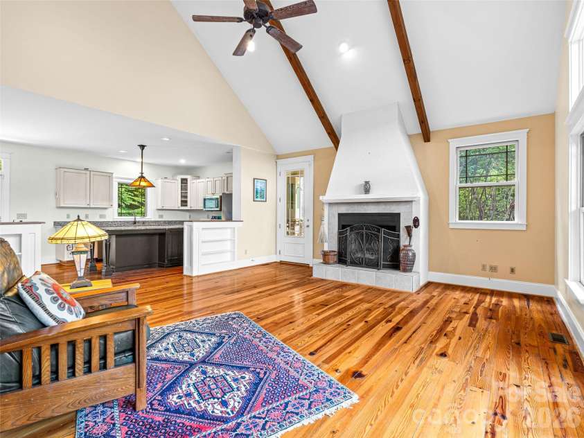890 Stoney Stream Lane, Arden, NC 28704.  MLS# CAR4395817, YatesRealty ID 34385. View of home's entry with fireplace in great room, open to kitchen.