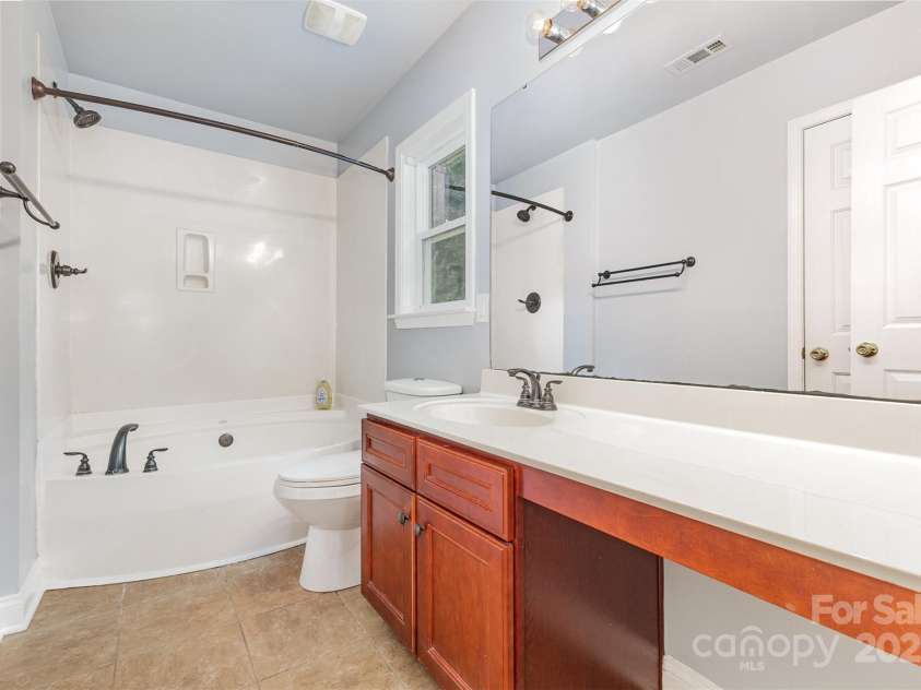 5009 Manchineel Lane, Monroe, NC 28110.  MLS# CAR4289637, YatesRealty ID 34389. Owner Suite Bathroom