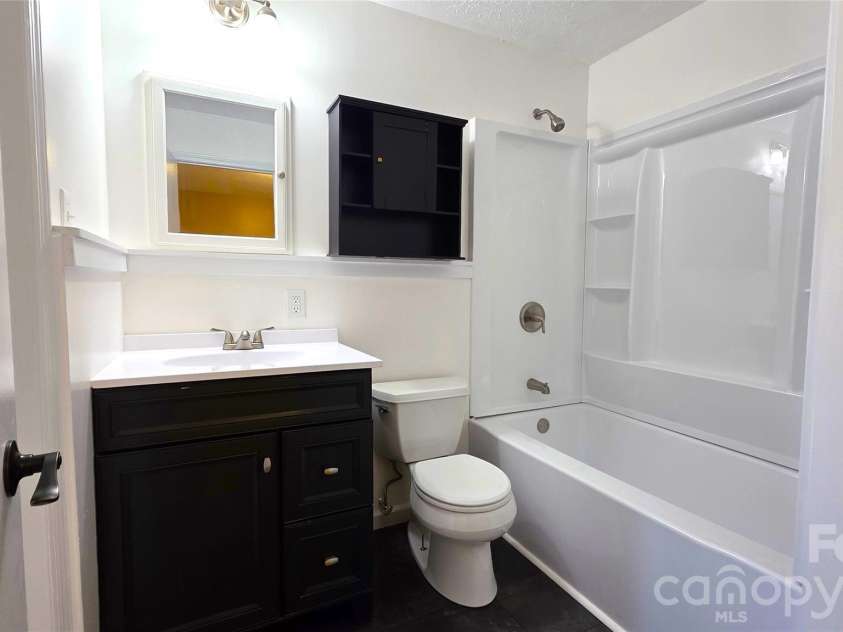 1627 Greenville Highway, Hendersonville, NC 28792.  MLS# CAR4338337, YatesRealty ID 34391. Hallway bathroom Freshly redone