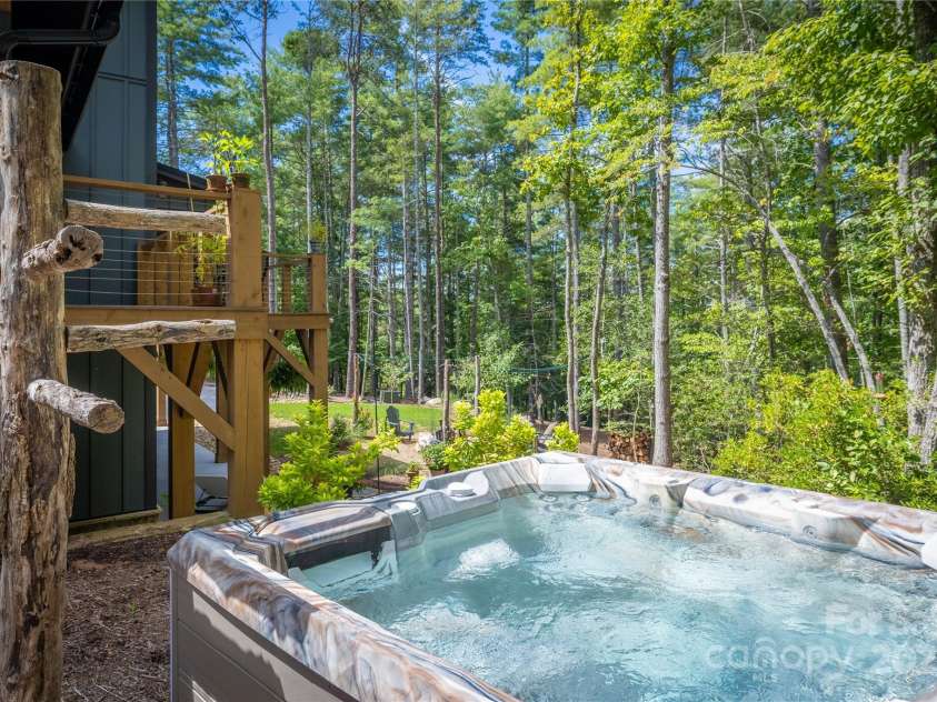 2116 October Drive, Nebo, NC 28761.  MLS# CAR4291536, YatesRealty ID 34399. Side Yard Hot Tub