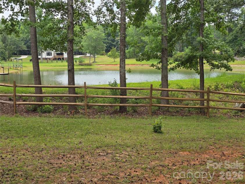800 Ethel Street, Waxhaw, NC 28173.  MLS# CAR4389407, YatesRealty ID 34399. Adjacent property pond view