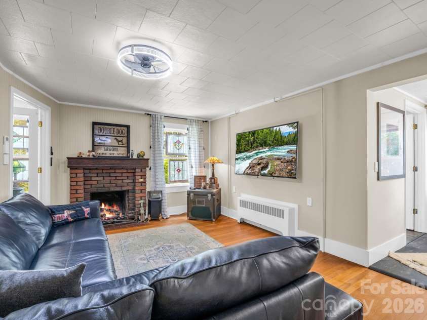 23 Sunset Drive, Black Mountain, NC 28711.  MLS# CAR4397312, YatesRealty ID 34401. Living Room with Fireplace