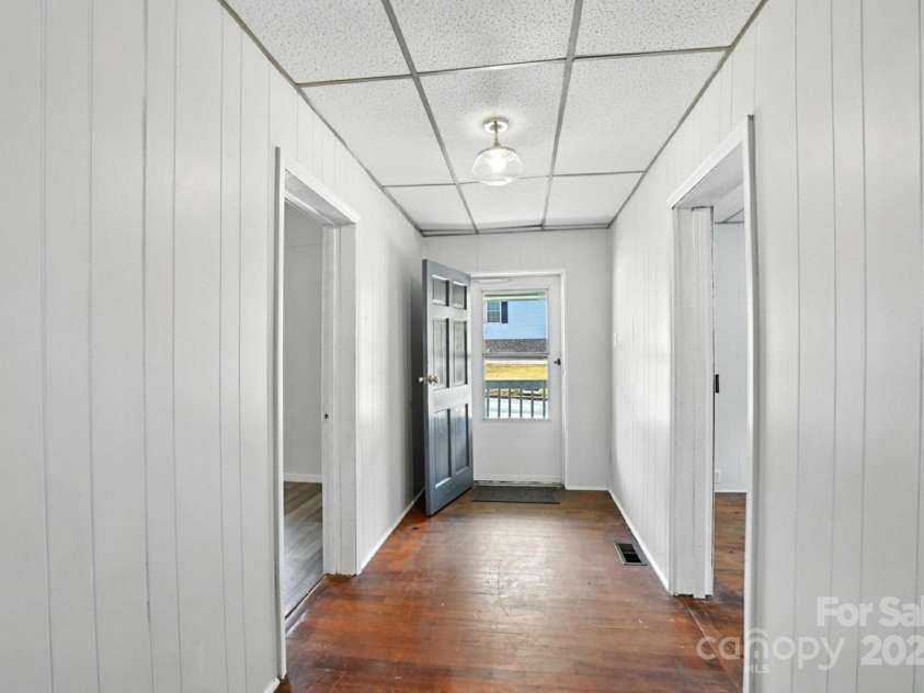 310 Sidney Johnson Street, Fort Mill, SC 29715.  MLS# CAR4274696, YatesRealty ID 34404. Foyer offers original wood floors