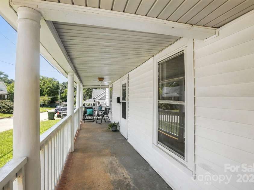 310 Sidney Johnson Street, Fort Mill, SC 29715.  MLS# CAR4274696, YatesRealty ID 34404. Rocking chair front porch
