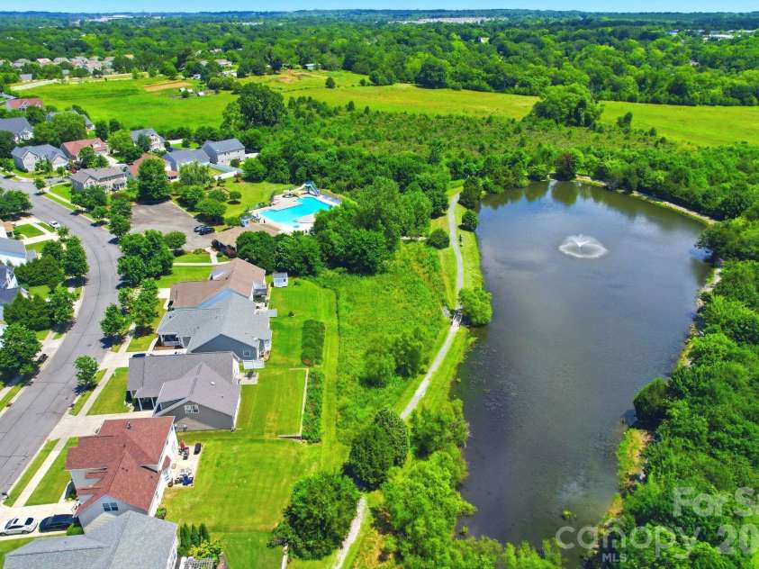3585 Leighton Drive, Concord, NC 28027.  MLS# CAR4397371, YatesRealty ID 34404. Community Pond with Walking Trails