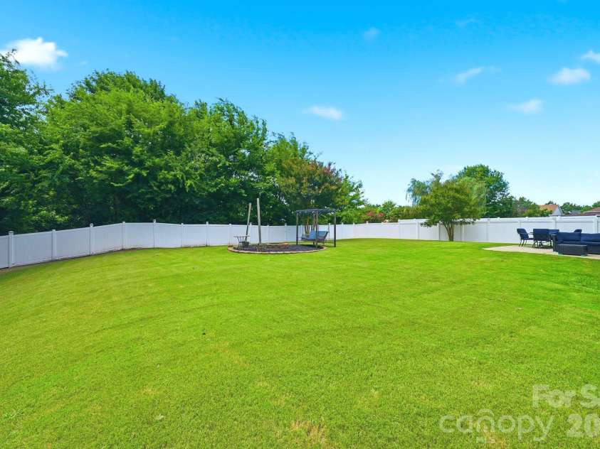 3585 Leighton Drive, Concord, NC 28027.  MLS# CAR4397371, YatesRealty ID 34404. Private Back yard
