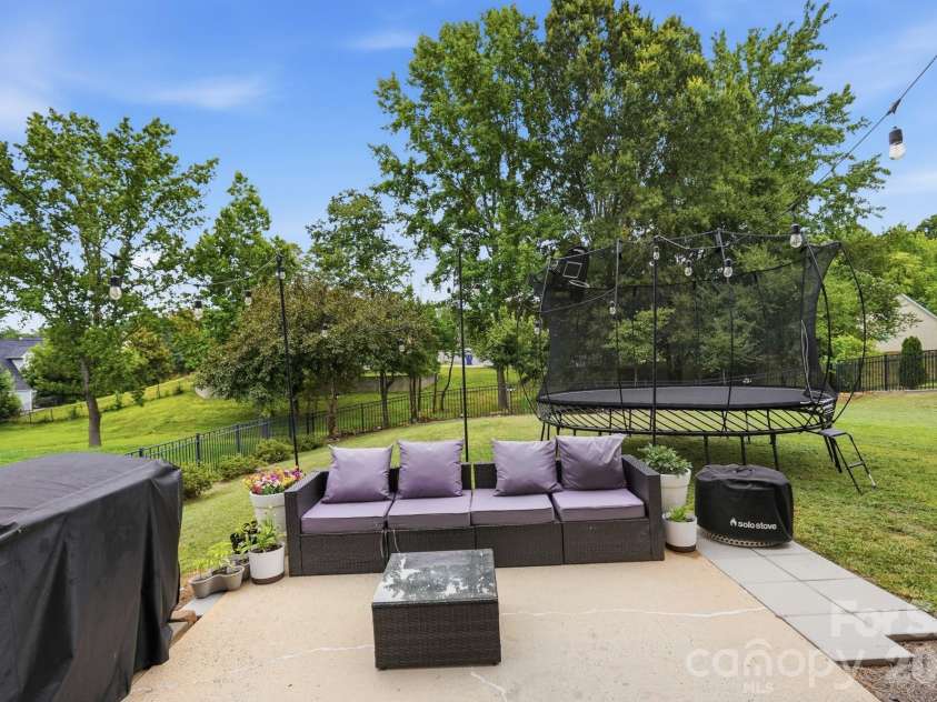 2616 Sierra Chase Drive, Monroe, NC 28112.  MLS# CAR4398992, YatesRealty ID 34413. Mature trees behind home