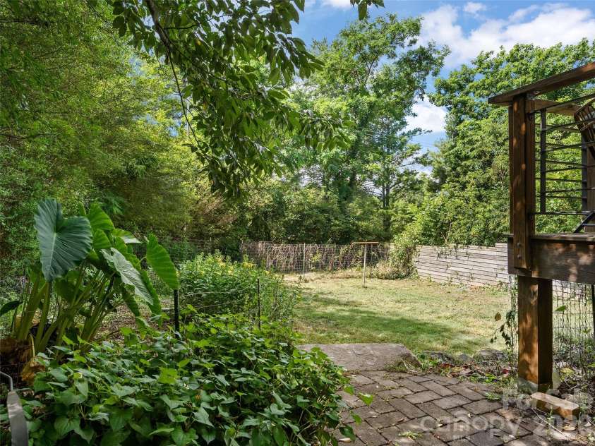 61 Walton Street, Asheville, NC 28801.  MLS# CAR4397351, YatesRealty ID 34414. View to spacious fenced backyard