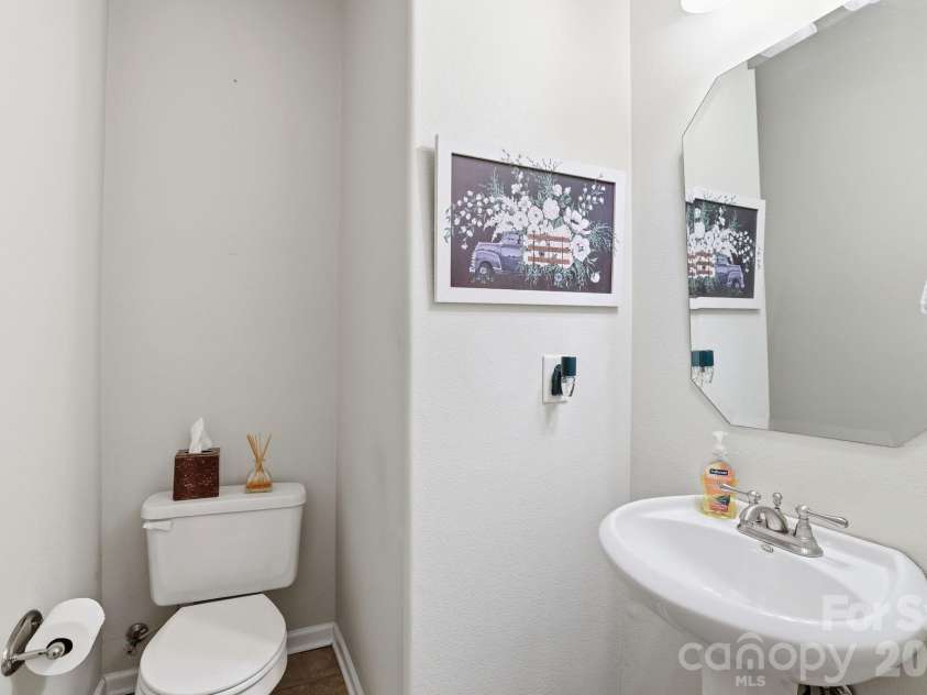 5304 Silabert Avenue, Charlotte, NC 28205.  MLS# CAR4398785, YatesRealty ID 34416. Convenient main-level half bath for guests.